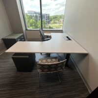 SOLD_Used L Height Adjustable Desk, Light Woodgrain Top, Charcoal Base